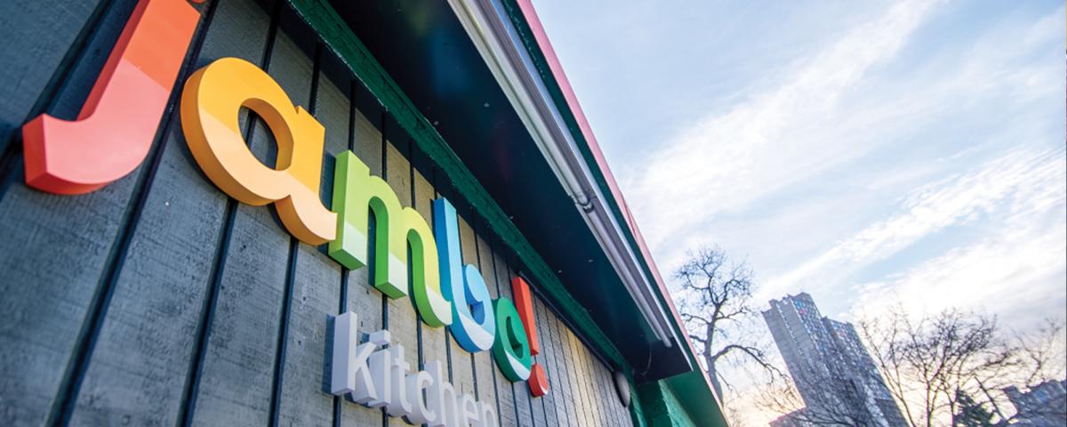 Image of Jambo! kitchen and catering sign taken from a jaunty angle