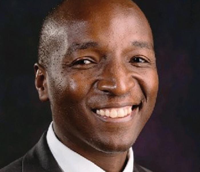 Edwin Migiro is a board member with African Development Center, MN Head shot of Edwin Migiro