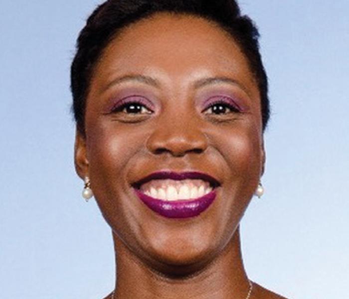 Kaade Wallace is a board member with African Development Center, MN Head shot of Kaade Wallace