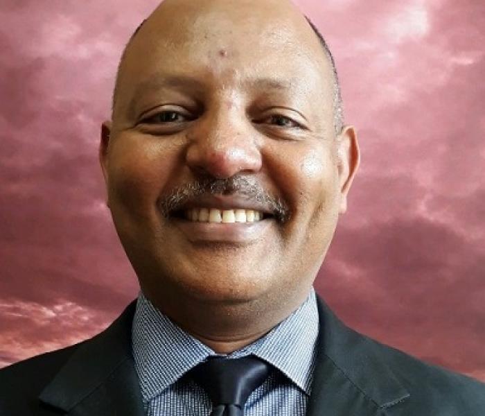Mekbib Dersolign is a Loan Committee Member with African Development Center of MN Headshot of Mekbib Dersolign